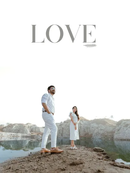 A minimalist and modern pre-wedding portrait by a quarry lake. The clean composition and simple "LOVE" text make a bold statement.