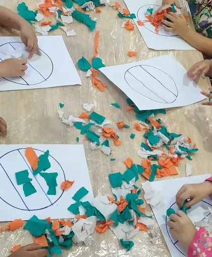 Children tear and paste pieces of colored paper to create the Indian flag. This is another great fine motor activity that ties into our cultural celebrations.