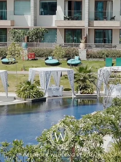 An overview of a beautiful brunch pool party setup. We arranged elegant white canopies by the poolside to provide shade for guests, creating a comfortable and stylish lounge area.