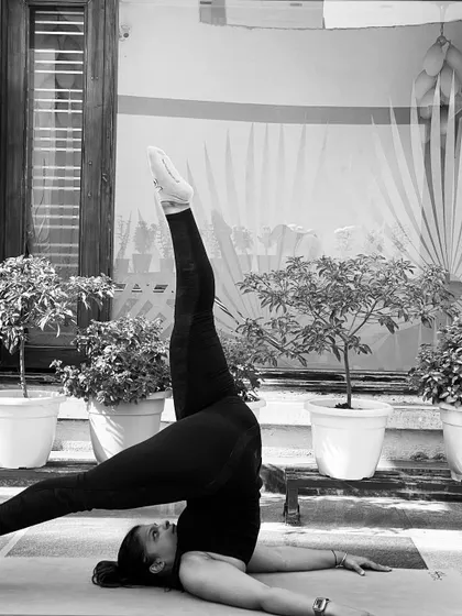 A black and white shot of the Shoulder Stand variation. It reminds me that even on cloudy days, we can find strength and lift ourselves up.