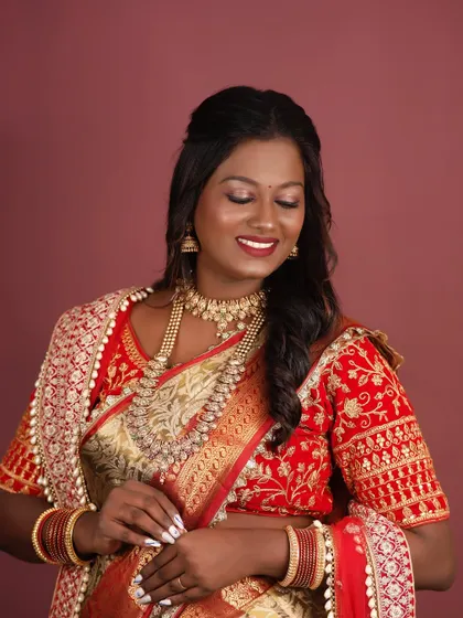 A happy, smiling shot that captures the essence of her beauty, enhanced by makeup.