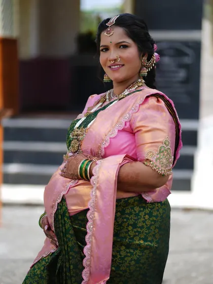 A happy, glowing portrait from the baby shower. The makeup is designed to be photogenic, ensuring every picture is a cherished memory.