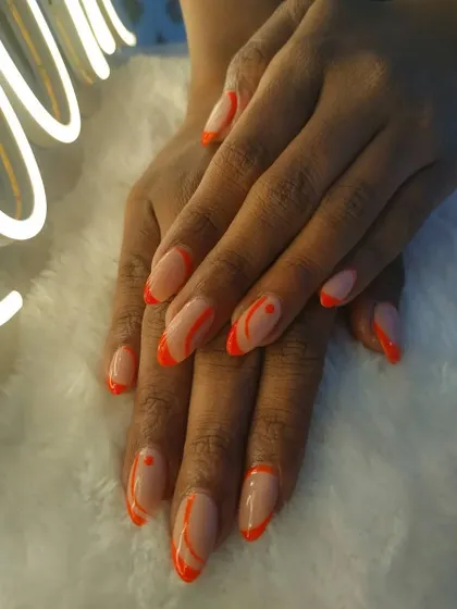 Some Saturday nail art inspiration. This design uses neon orange for an abstract French tip look.