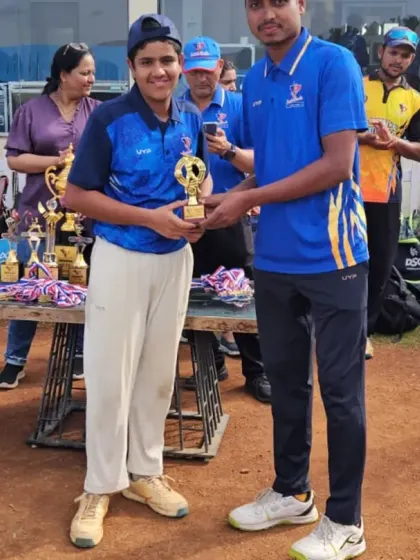 Recognizing talent across the board, a player receives her award, highlighting our commitment to encouraging all young cricketers.