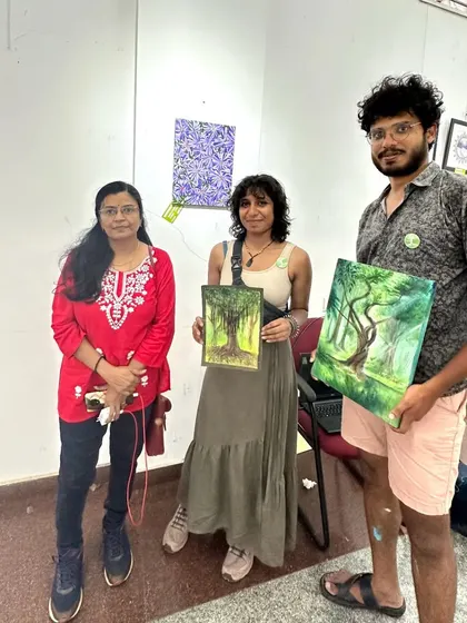 With a group of young, talented artists at an exhibition.