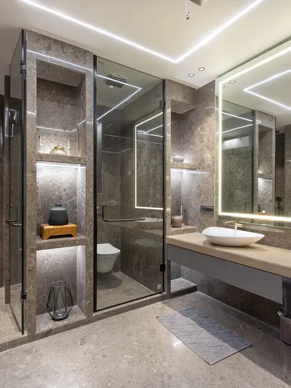 Another angle of the same bathroom, highlighting the spacious layout and the clean lines of the custom joinery and glass partitions.