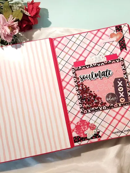 The first page of the anniversary scrapbook, featuring a beautiful "soulmate" shaker element.