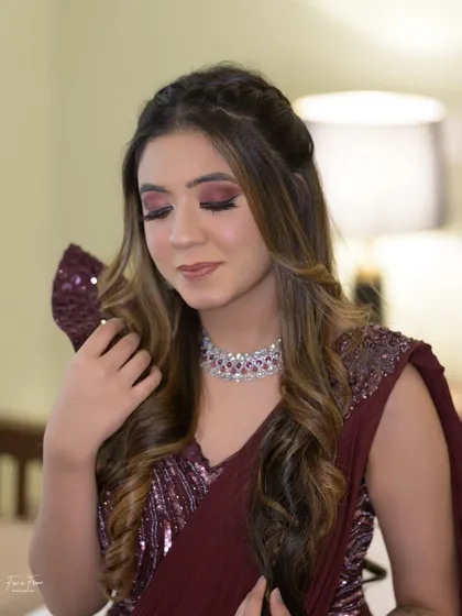Another angle of this stunning cocktail look. The half-up hairstyle complements the glamorous makeup, creating a complete and polished look for any evening event.