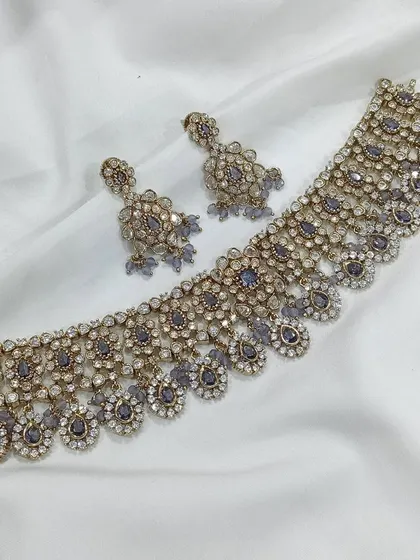 A unique and modern choker set with grey stones. This is a great choice if you are looking for something different to stand out at an event.