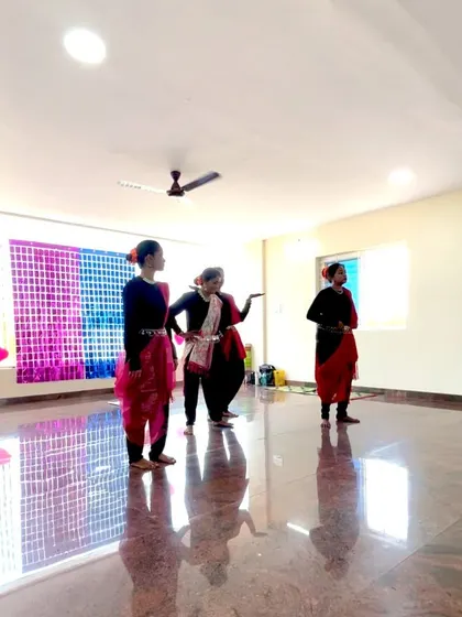 The performers in the middle of their routine for Women's Day, showcasing their grace and coordination.