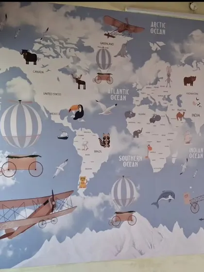 I love making kids' rooms fun and educational. This large world map wallpaper is not just a beautiful decoration but also a great learning tool, installed with precision to create an adventurous atmosphere for a child's bedroom or play area.