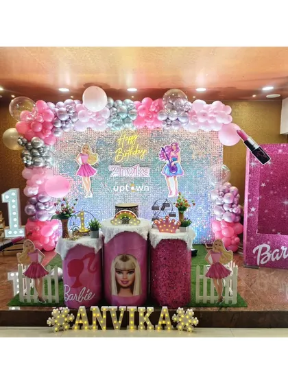 Another view of the Barbie party, showing the full stage and light-up number '1'.