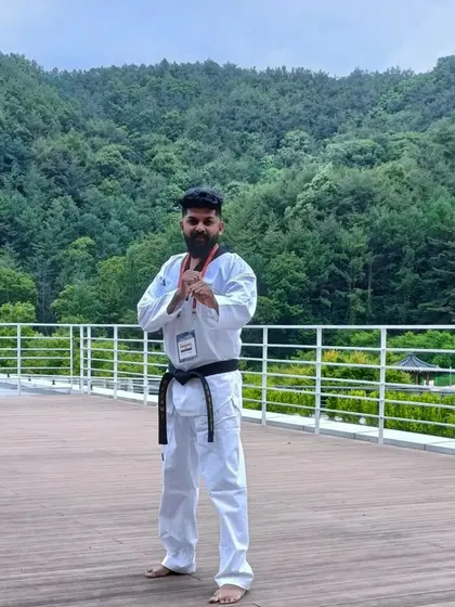 On a rooftop in Muju, with the beautiful Korean mountains in the background.