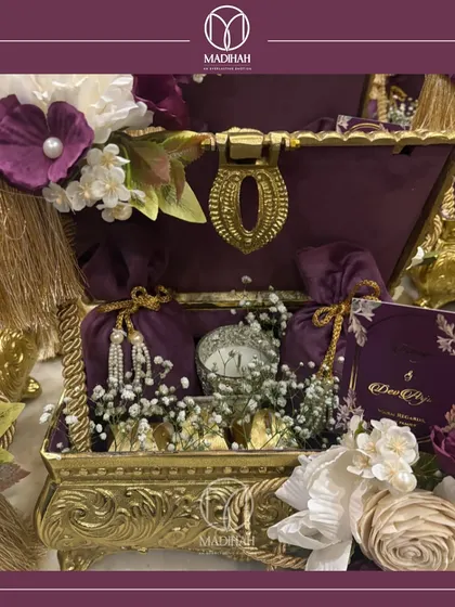 This beautifully composed shot of the Rajwada Chest, with its deep purple and gold tones, captures the essence of a gift fit for royalty. It's a promise of a cherished memory.