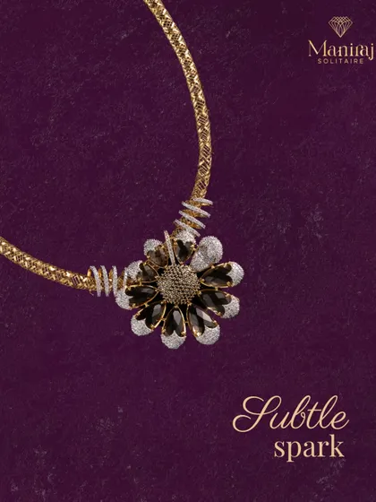 Simple, yet stunning. This necklace features a black and white floral pendant on a textured gold chain. It's a versatile piece that adds the perfect touch of sparkle to any look, day or night.