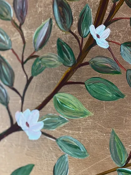 A close-up of the hand-painted leaves and blossoms. You can see the texture of the gold leaf beneath the acrylic paint, which gives the piece a beautiful, layered quality.