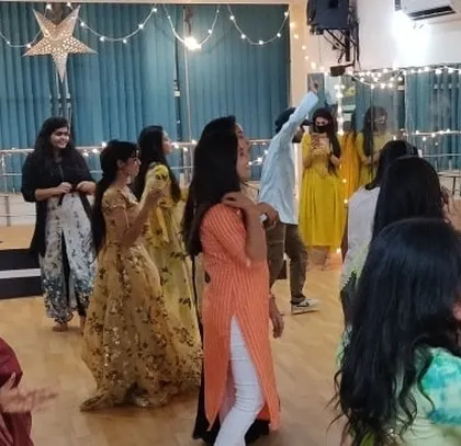 Candid moments from our beautiful Diwali celebration, with members dancing in their traditional outfits.