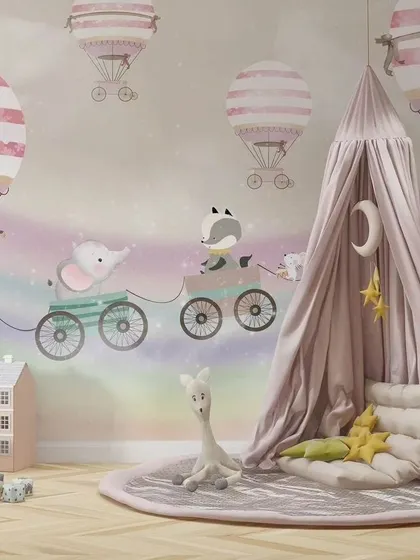 The animal train wallpaper shown in a beautifully styled nursery with a canopy tent.