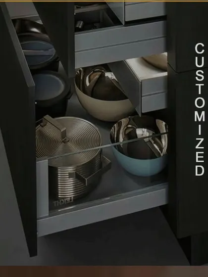 We offer fully customized drawers to fit your specific needs. This deep drawer is designed to hold large pots, pans, and bowls, featuring smooth-gliding hardware that can handle heavy loads.