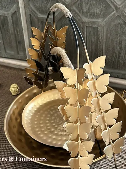 A close-up of the butterfly-handled basket, a versatile piece for both serving and decor.