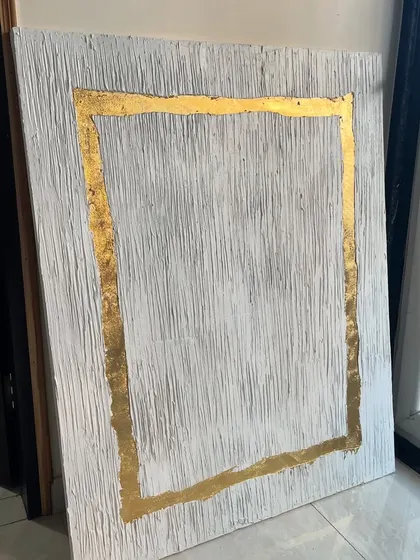 The gold leaf and texture piece for Hyderabad, seen here in my studio. The raw, uneven edge of the gold rectangle gives it an organic, handmade feel.