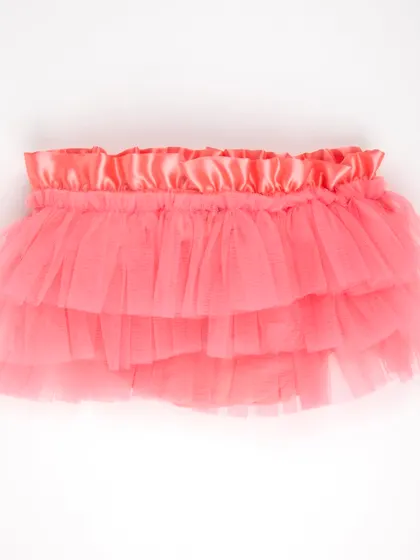 The front view of the coral-colored tulle tutu skirt.