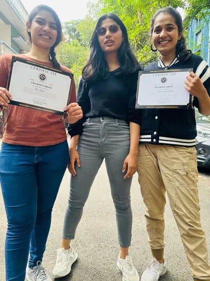 Three graduates proudly display their certificates. They are the newest members of the Heels on Wheels sisterhood.