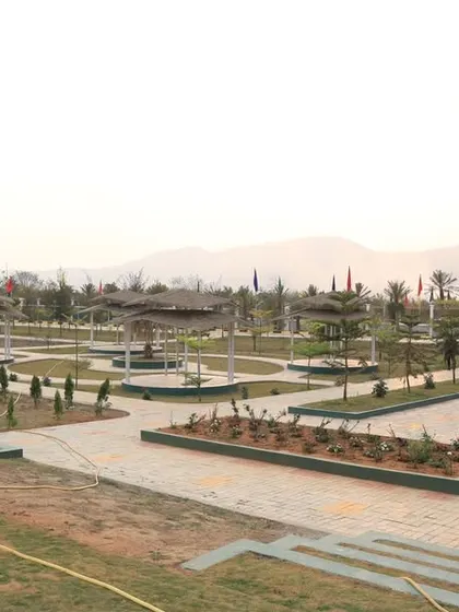 The completed pathways and planting beds at UNACCO School, showing the clean, formal lines of our landscape design being implemented on site.