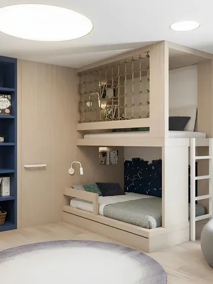 A clean and modern kids' room with a loft bed, built-in blue shelving, and a cozy beanbag chair for reading.