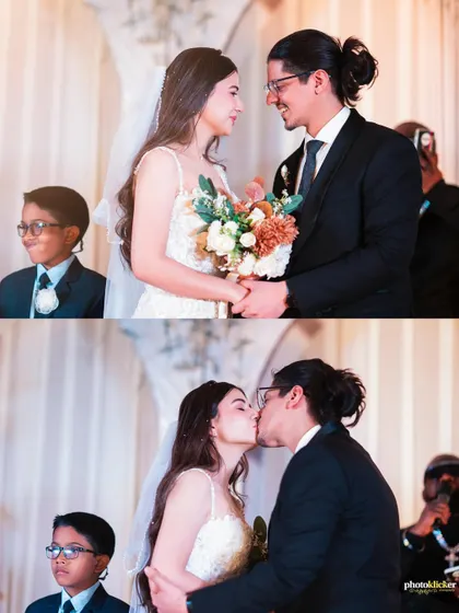 The sealing of vows with a kiss. This moment from a beautiful Christian wedding ceremony highlights our experience in capturing the sanctity and joy of diverse cultural celebrations.