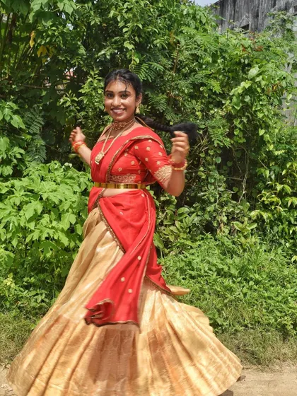 Another joyful shot of my client at her housewarming. The movement of the half-saree skirt is perfect for candid, happy pictures.