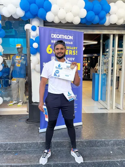 Standing at the finish line with my certificate and medal. This moment represents the culmination of deciding to change, putting in the work, and achieving a goal I set for myself.