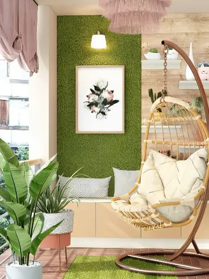 A soft and dreamy boho-chic balcony. The combination of a light-colored swing chair, a faux grass wall, and pastel pink curtains creates a gentle and relaxing atmosphere.