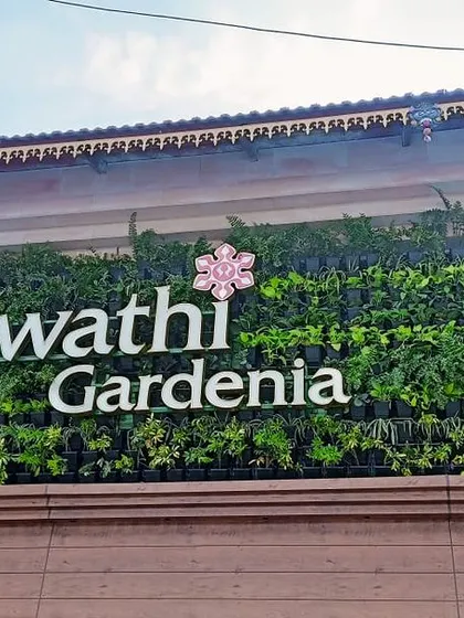 This is a duplicate of image 74. We help businesses make a green statement with stunning vertical gardens. This living wall we designed and installed for Swathi Gardenia transforms their building's facade into a landmark of lush, sustainable design.