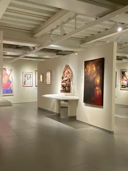 A long view through a gallery at the Museum of Art and Photography (MAP), showing how spaces flow into one another. The design encourages exploration and allows for multiple pathways through the museum's collection.
