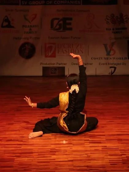 The elegance of a classical dance performance seen from the back.