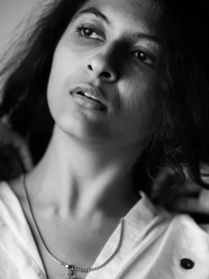 A thoughtful pose in a simple white shirt. This monochrome portrait from my boudoir series captures a quiet, contemplative mood with a focus on natural beauty.
