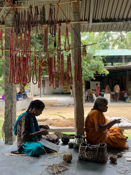 Local artisans in Anegundi creating traditional beadwork. We collaborate with such communities to bring authentic, handmade elements into our contemporary designs.