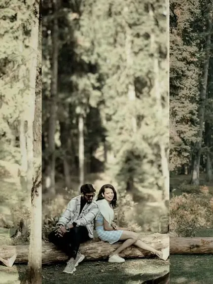 A creative composition showing Rahul and Priyanka sitting on a log, reflected as if in a dream. This artistic edit adds a layer of depth and visual interest to their forest portraits.