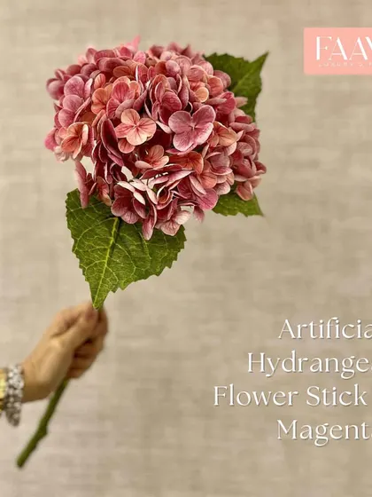 This artificial hydrangea flower stick in a vibrant magenta adds a wonderful pop of color. The large, full bloom makes a statement on its own or within a bouquet.