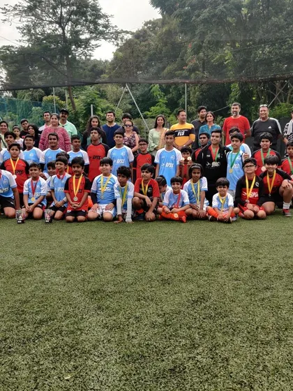 The entire group of participants and supporters from our competition day. It takes a village to build a successful football academy.