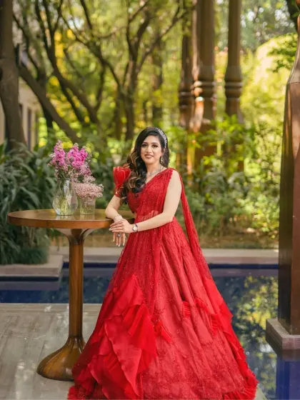 A full-length shot of the bride by the pool. Her makeup is designed to be flawless and long-lasting, perfect for an outdoor event.