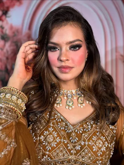 A close-up of this bold party look. The smokey eyes are the star of the show, balanced with a neutral lip and glowing skin.