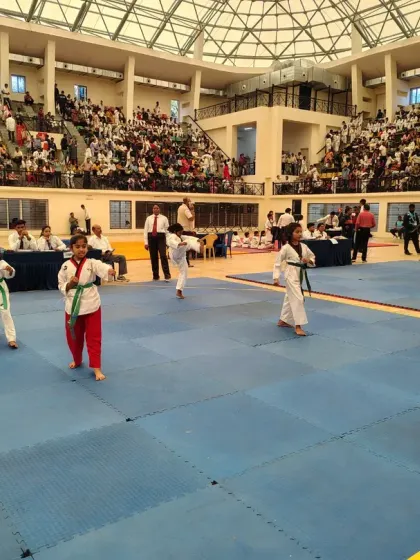 Our young athletes in the middle of their Poomsae performance at a state-level championship.