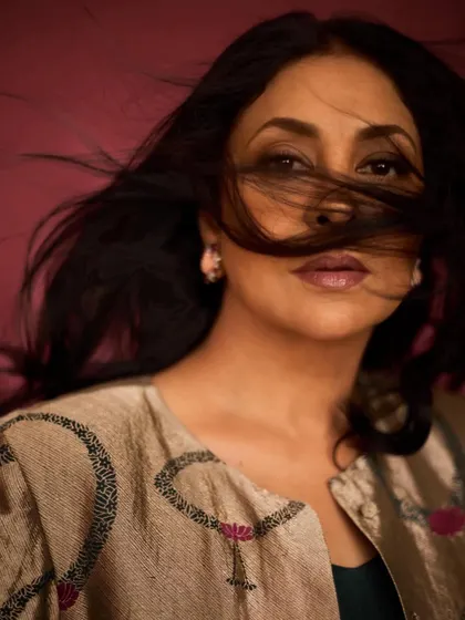 An artistic close-up with hair blowing in the wind, creating a dramatic and memorable shot.