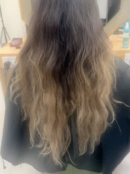 The "before" shot, showing the brassy and uneven color we corrected.
