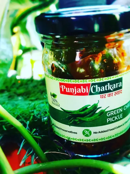 The vibrant Green Chilli Pickle, a spicy and tangy treat that is 100% homemade.