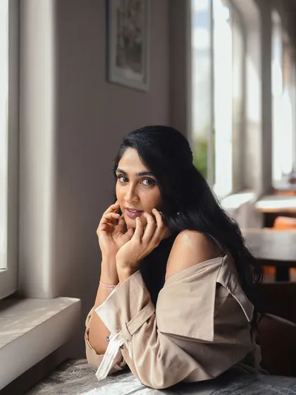 A classic portrait from the 'Bonsoir' series. The natural light and simple styling make this a great example of an approachable yet polished look for a personal branding photoshoot.