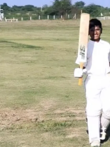 A batsman proudly walks off the field after his innings on the Chitradurga tour.