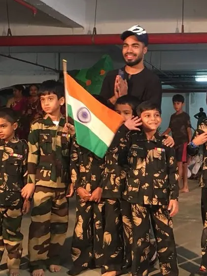 Another shot of my little soldiers saluting the flag for their Independence Day show. Themed performances like this are a great way to make any event special.